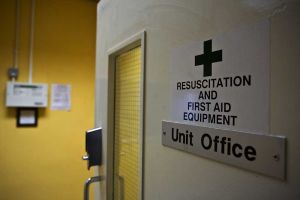 The Unit Office showing Sign and Yellow Door